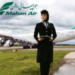 A picture of a Mahan flight attendant in front of a plane from Mahan Airlines
