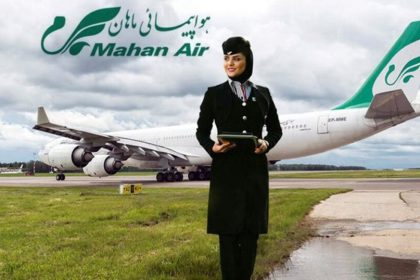 A picture of a Mahan flight attendant in front of a plane from Mahan Airlines