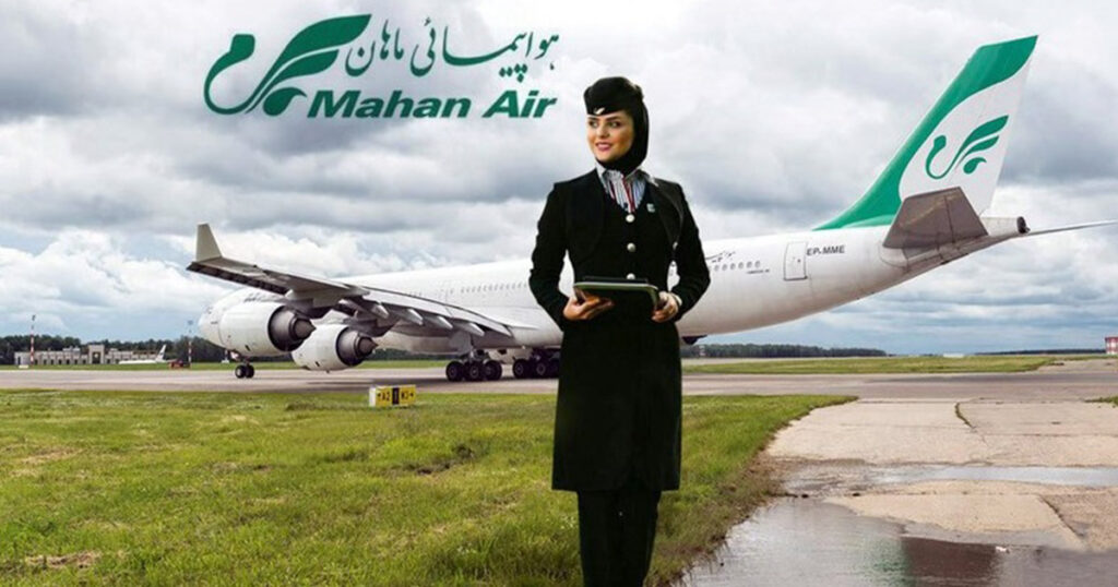 A picture of a Mahan flight attendant in front of a plane from Mahan Airlines