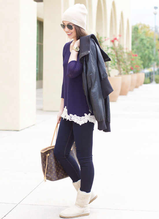 With a jacket and knitted hat