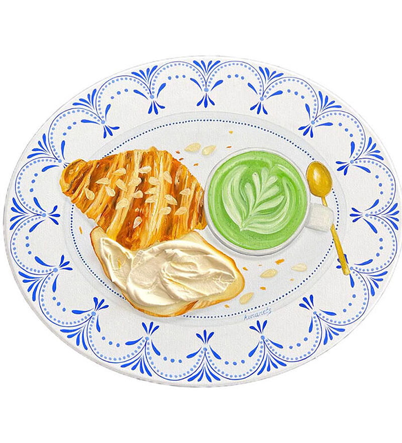 Cut croissants with green lettuce on the plate