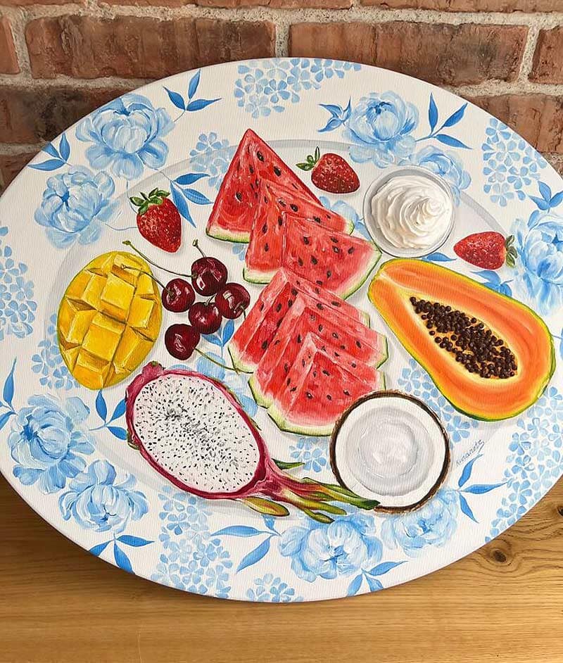A variety of fruits painted on a plate