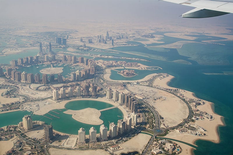 Flying over Doha, Qatar; Photo Source: Travel Agent Central, Photographer: Hvoenok