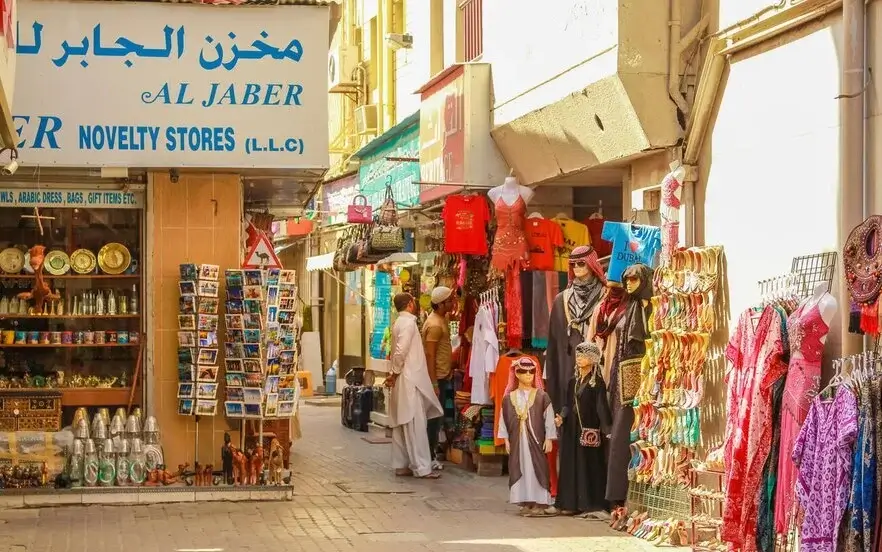 Buying souvenirs from Deira market