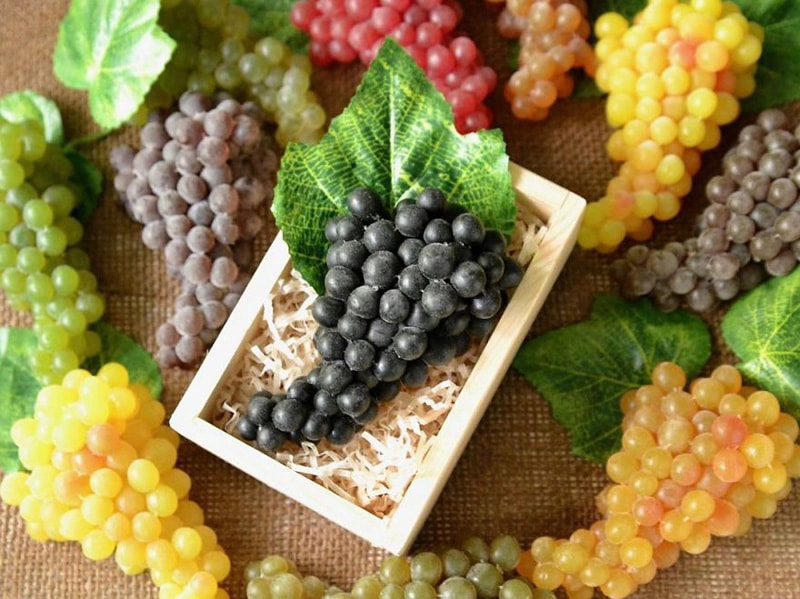 Soap in the form of bunches of different grapes