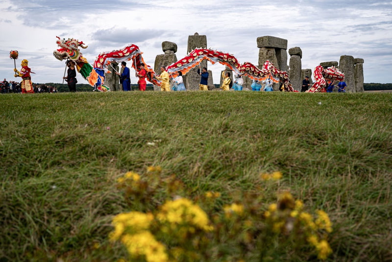 Dragon dance on the occasion of autumn harvest festival at Stonehenge, England