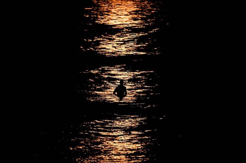 Surfing under the moonlight at Manly Beach, Sydney, <a href=