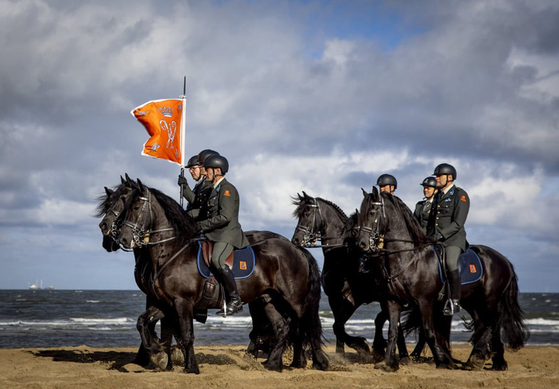 Members of the Dutch Cavalry Honorary Escort practice on the beach for the Royal Procession in The Hague