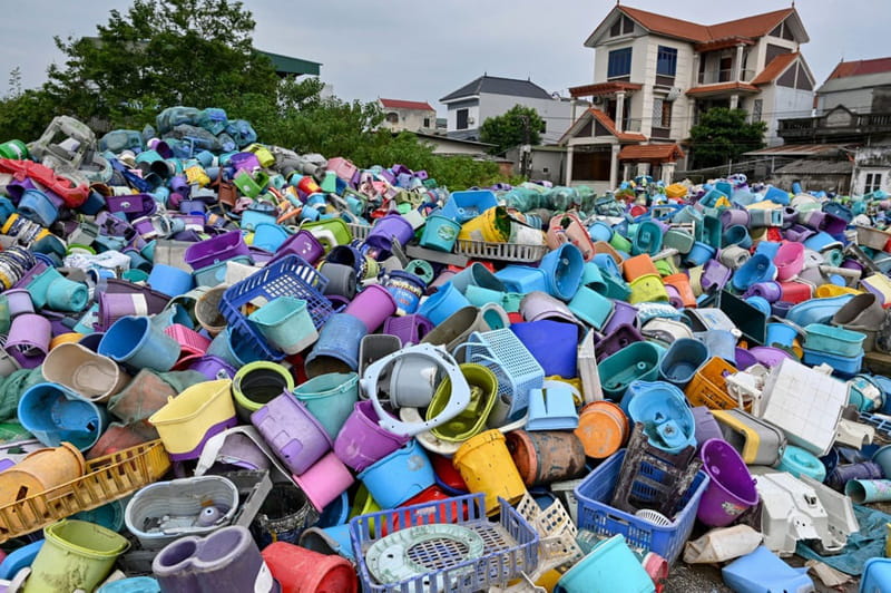 A pile of plastic waste at a recycling site next to a residential area on the outskirts of Hanoi, Vietnam
