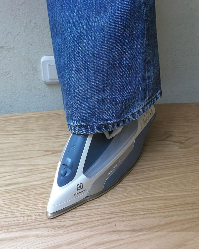 Combination photo of iron and pants 