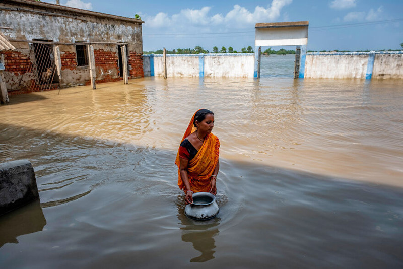 Indian woman searching for drinking water around the mangrove forests of the Bay of Bengal