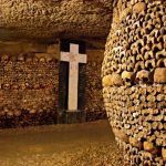 Paris catacombs with a wall of bones; Photo source: afar.com site. Photographer: Heracles Kritikos