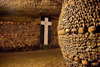 Paris catacombs with a wall of bones; Photo source: afar.com site. Photographer: Heracles Kritikos