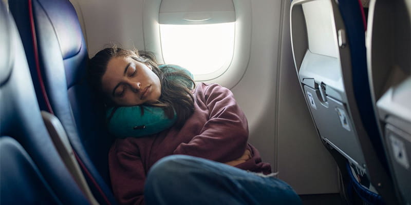 Sleeping in an airplane seat, photo source: wich.co.uk, photographer: unknown