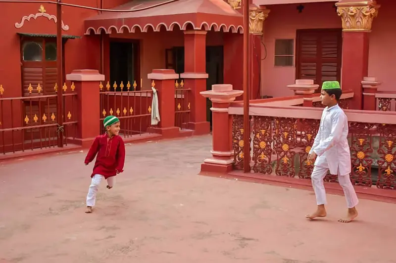 Indian boys play in the alley