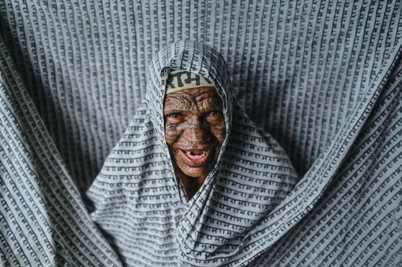 Indian old woman in traditional tent