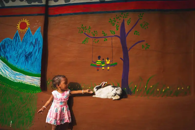 Indian girl next to the wall