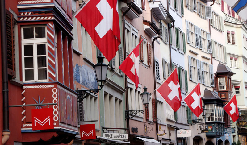 Swiss buildings with Swiss flags; Photo Source: WorldFirst, Photographer: Unknown