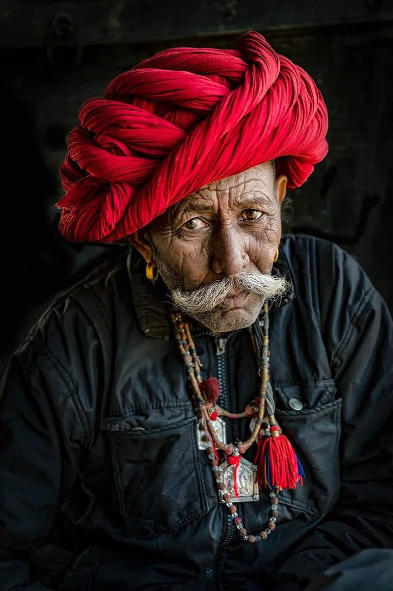 Indian man with red gloves