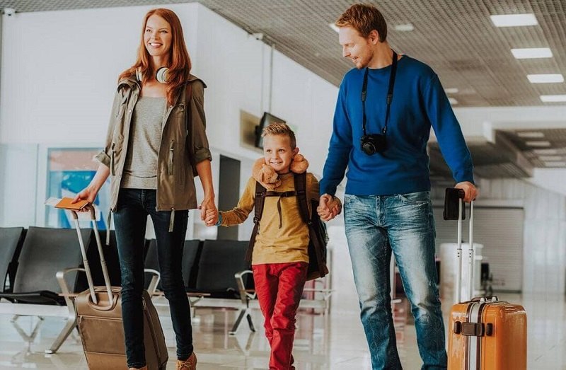 family travel with cabin size luggage; Photo source: Four Around The World website. Photographer: Unknown