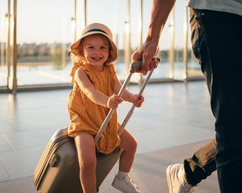   The child sitting on the luggage of the size cabin; Photo source: Kayak.com website. Photographer: Unknown