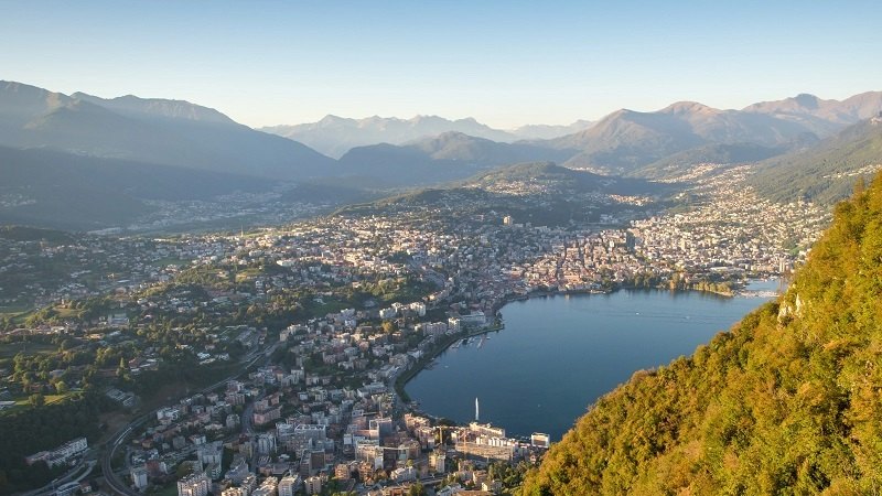 Aerial photo of Lugano, Switzerland in autumn; Photo source Switzerland Tourism website. Unknown photographer