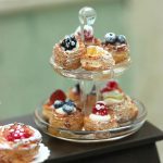 A two-tier container of miniature sweets made by Shai Aaron