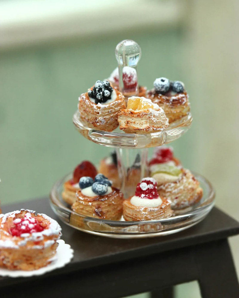 A two-tier container of miniature sweets made by Shai Aaron