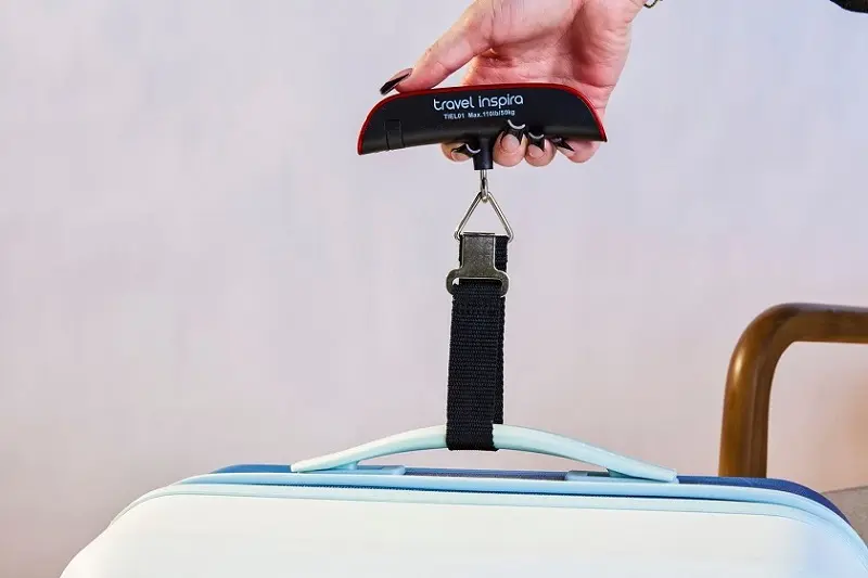 How to use a luggage scale; Photo source: Travel + Leisure website. Photographer: Unknown