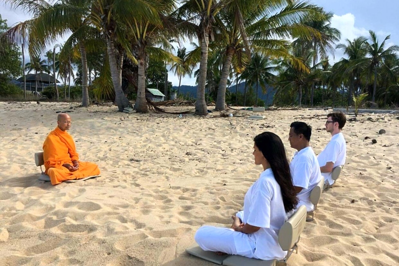 Buddhist meditation on the beach; Photo source: bookretreats.com. Photographer: Unknown