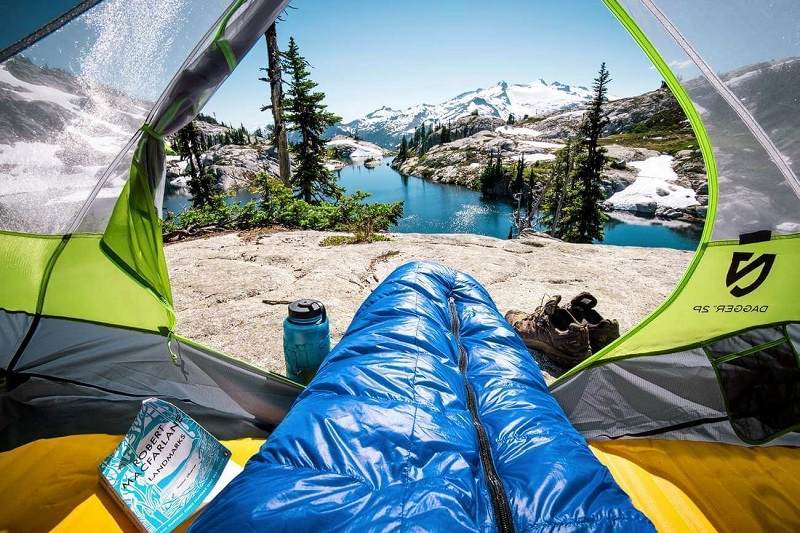 resting with a sleeping bag in a tent; Photo source: Washington State Tourism website. Photographer: Unknown