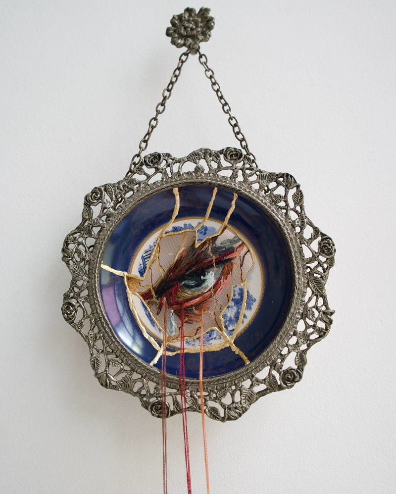 Eye design on a blue porcelain plate