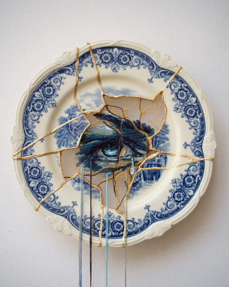 Eye design embroidery on a china plate