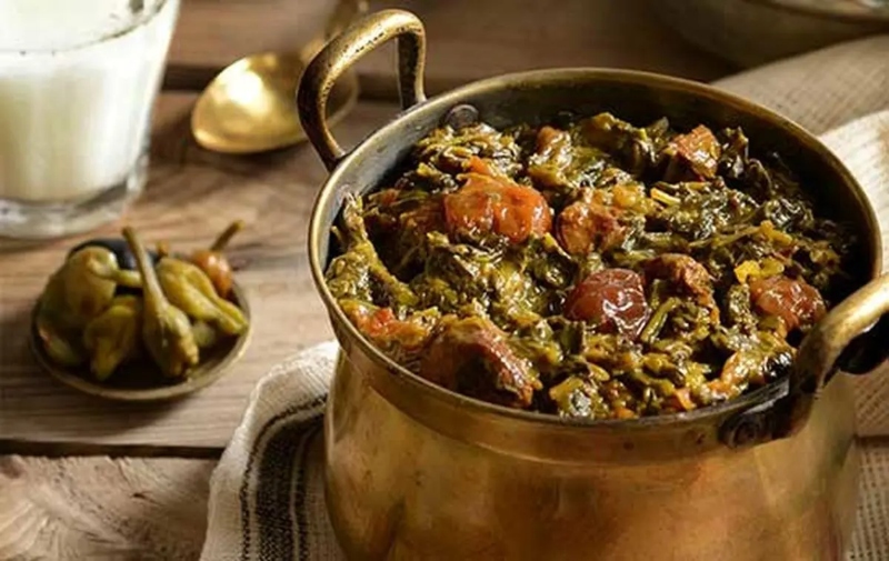 Plum and spinach stew in a copper pot; Photo source: ilna.ir website. Photographer: Unknown