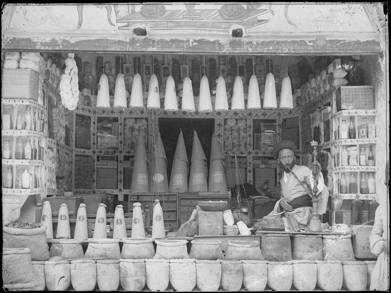 Historical photo of a shop in Rasht, photo by Antoine Sorogin