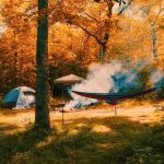 Autumn camping with a tent and Neno; Photo source: wallpapers.com website; Photographer: Unknown