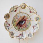 White porcelain plate with embroidery and eye design