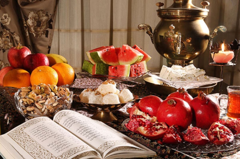 Yalda table with samovar, watermelon, nuts and pomegranate; Photo source: hamshahrionline.ir site. Photographer: Unknown