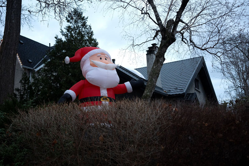 A display of an inflatable Santa to welcome Christmas in Toronto, <a href=