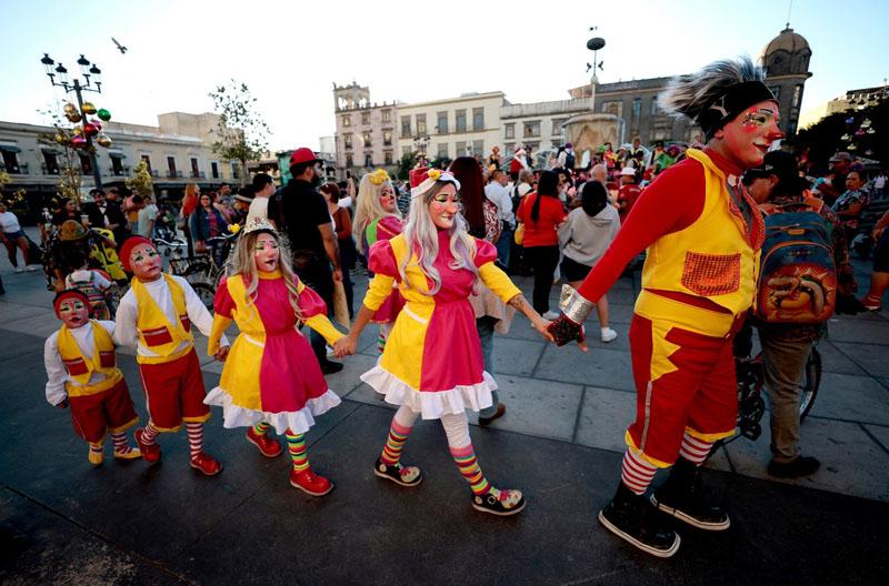   A family of clowns on National Clown Day in front of Guadalajara Cathedral in <a href=