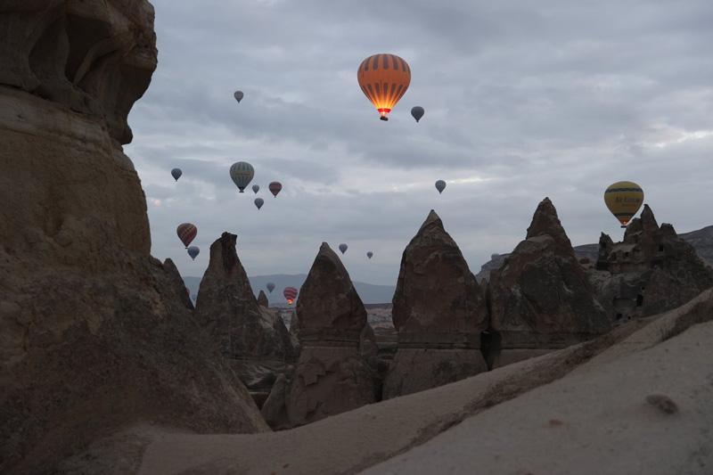 Hot air balloons over the Cappadocia region in Türkiye; Source: theguardian; Photographer: Behcet Alkan