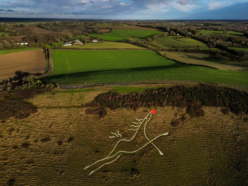 A transformation of Folkestone's white horse inspired by Rudolph the Red-Nosed Reindeer; Source: theguardian; Photographer: Chris J Ratcliffe