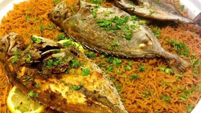 Mohamar with fish; Photo source: besraha.com; Photographer: Unknown