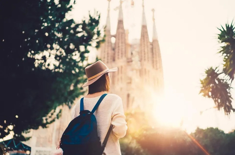 Tourist in front of Sagrada Familia Church; Photo Source: Forbes, Photographer: Unknown