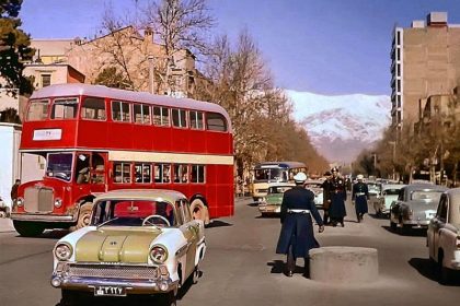 Historical photo of old Tehran with a red double-decker bus