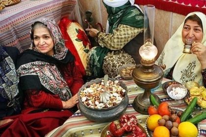 Yalda table with pomegranate and nuts on the chair; Photo source: blog.okcs.com. Photographer: Unknown