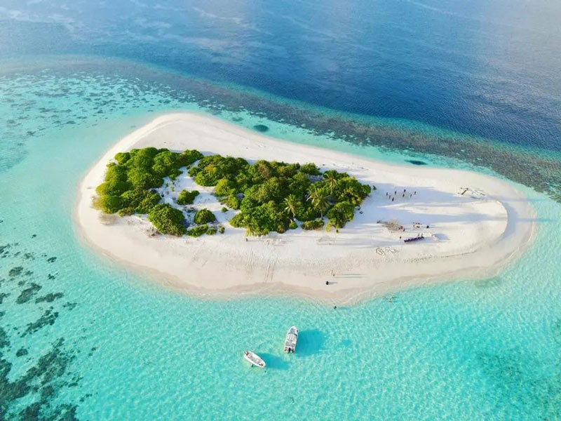 Aerial photo of one of the Maldivian islands; Photo Source: Forbes, Photographer: Unknown