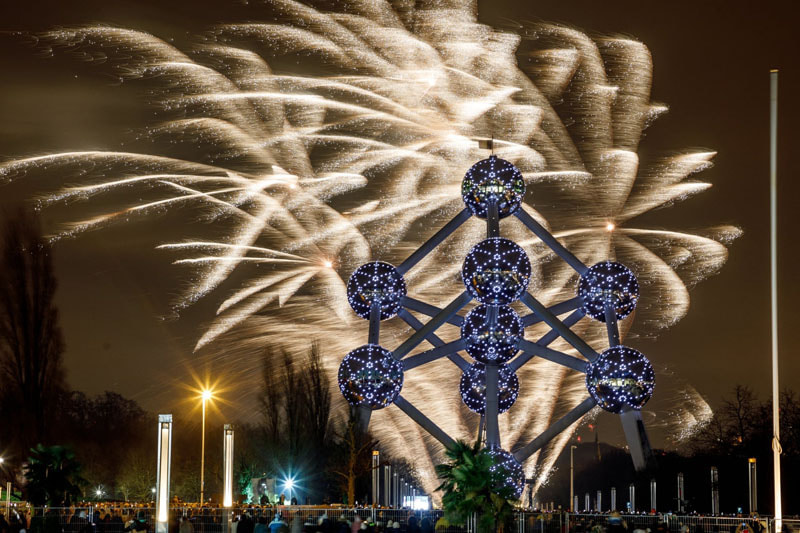 New Year's fireworks in the sky of Brussels, Belgium; Photo source: guardian; Photographer name: Hatim Kaghat
