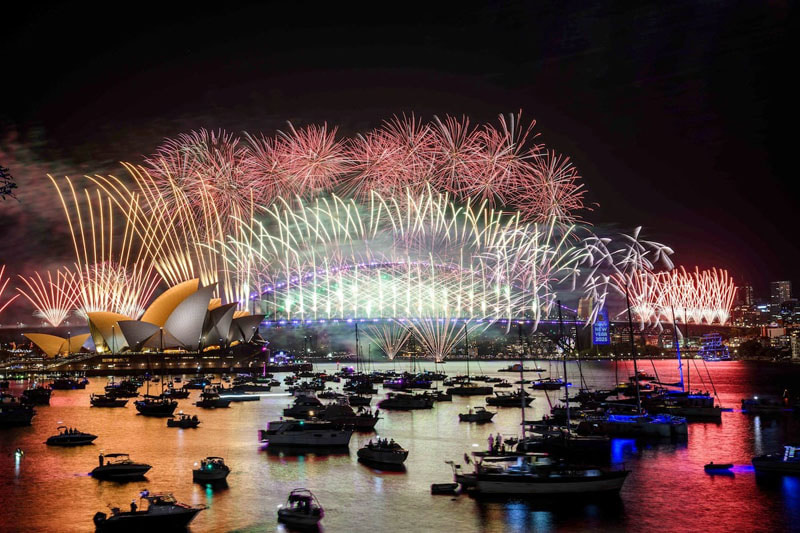 Fireworks over the Sydney Opera House and Harbor Bridge during New Year's celebrations in Sydney, Australia; Photo source: Reuters; Photographer name: Bianca De Marchi