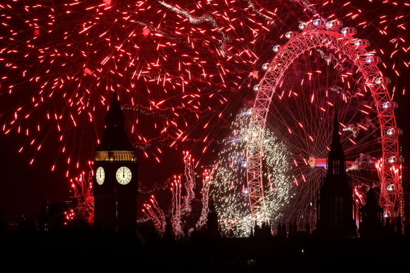 Fireworks in the sky around the London Eye and Big Ben clock; Photo source: guardian; Photographer name: Adrian Dennis